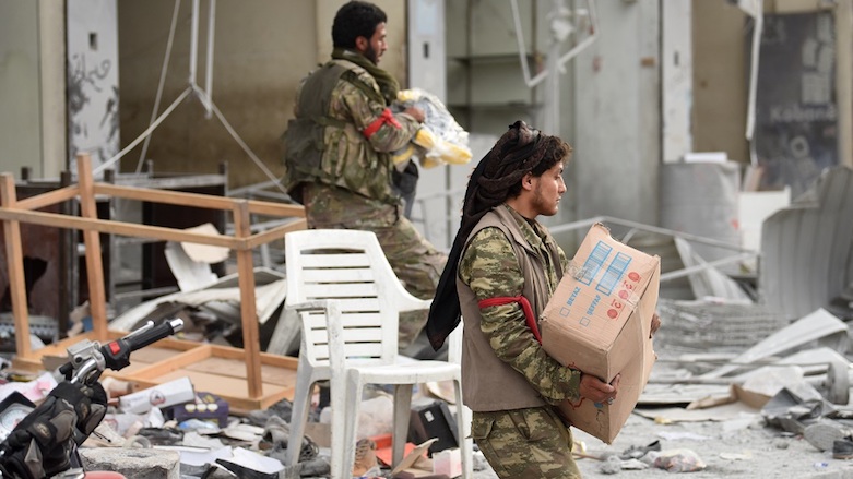 Turkish-backed Free Syrian Army (FSA) loot shops after seizing control of the town of Afrin in Syrian Kurdistan from the US-armed Kurdish forces, March 18, 2018. (Photo: AFP)