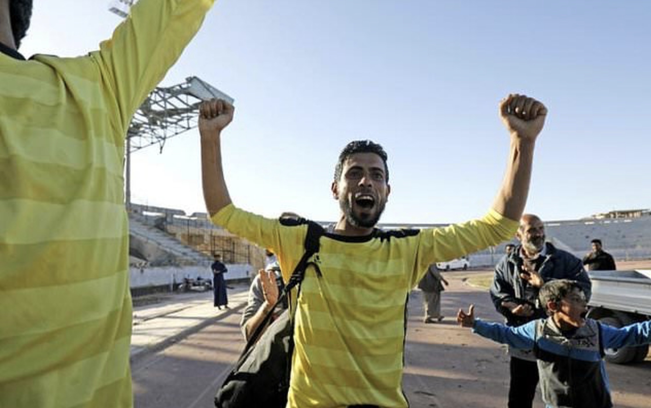 A player celebrates after a football match on April 16, 2018, between local teams at a stadium in Raqqa that the Islamic State once used as a prison. (Photo: AFP)
