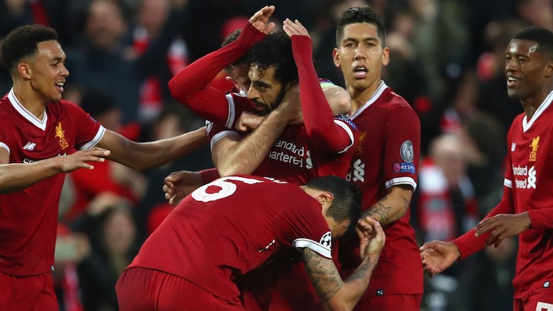 Liverpool players congratulate teamate Mohamed Salah after he scores in his side's 5-2 win over Roma, April 24, 2018. (Photo: UEFA)