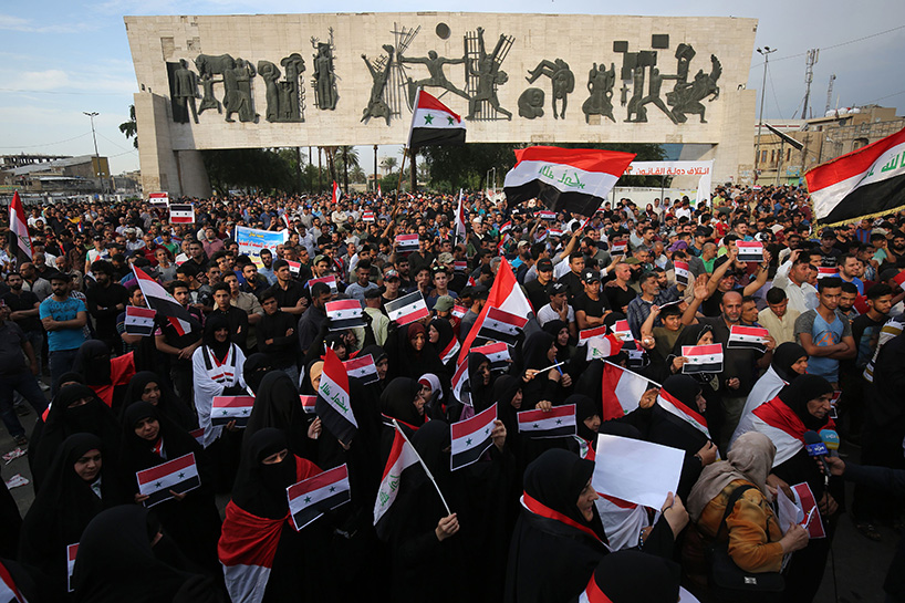 Iraqi protestors burn a US flag during a protest in Baghdad on Sunday opposing the joint Western airstrikes against Syria's regime. (Photo: AFP)