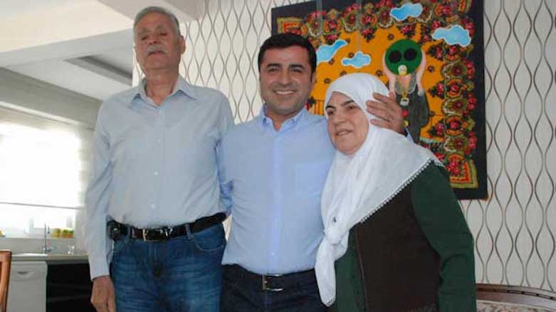 Kurdish politician Selahattin Demirtas (center) seen in this picture with his father Tahir Demirtas and mother Sadiye Demirtas in their Diyarbakir home a year before his arrest by Turkish authorities, Sep. 9, 2015. (Photo: HDP)
