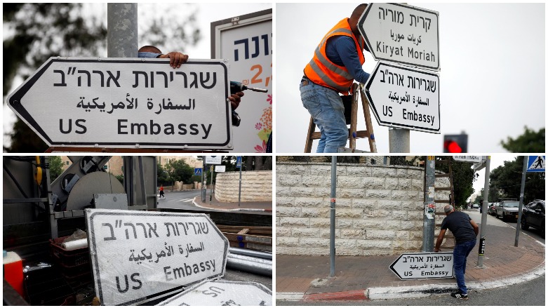 Workers hangs a road sign directing to the US Embassy, in the area of the US consulate in Jerusalem, May 7, 2018. (Photo: Reuters/Ronen Zvulun)