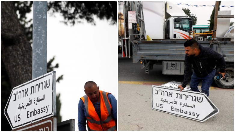 Workers hangs a road sign directing to the US Embassy, in the area of the US consulate in Jerusalem, May 7, 2018. (Photo: Reuters/Ronen Zvulun)