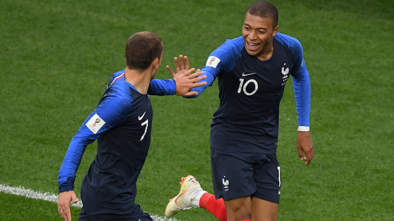 France's forward Kylian Mbappe (right) celebrates his goal with France's forward Antoine Griezmann during the 2018 World Cup Group C football match between France and Peru at the Ekaterinburg Arena in Ekaterinburg, Russia, on June 21, 2018. (Photo: AFP/Jorge Guerrero)