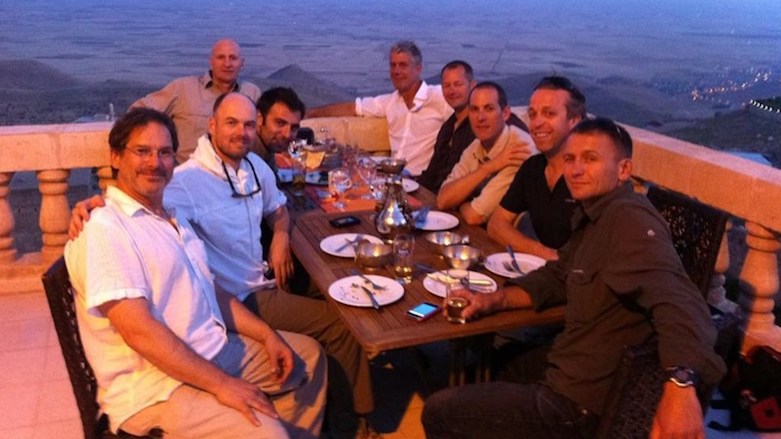 A place to enjoy the view; the late Anthony Bourdain (far back on the right) seen with his TV crew on the rooftop of a restaurant overlooking where the Mesopotamian Plain begins, in Mardin, Kurdistan of Turkey, June 9, 2011 (Photo: Bourdain archive)