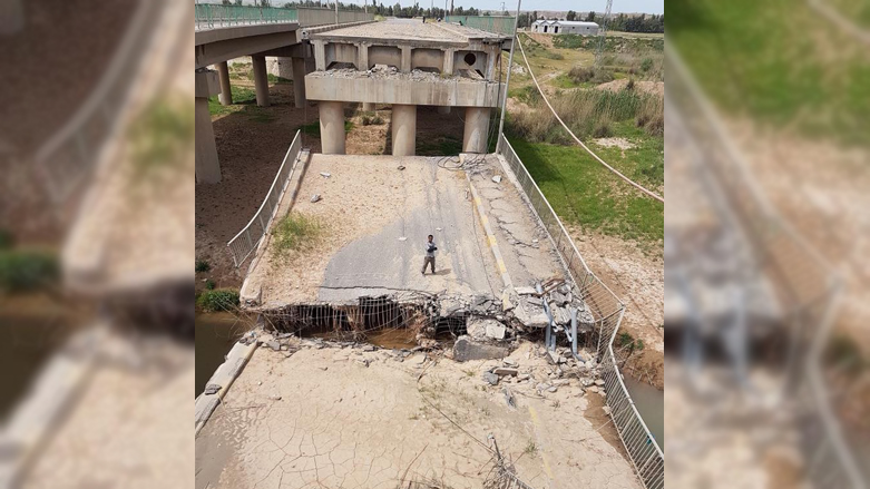 A photo shows the destruction of a bridge on the Erbil-Kirkuk path. 