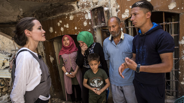 UNHCR Special Envoy Angelina Jolie meets with Mohamed and his family during a visit to the Old City in West Mosul, Iraq, on June 16, 2018. (Photo: AFP/UNHCR/Andrew McConnell)