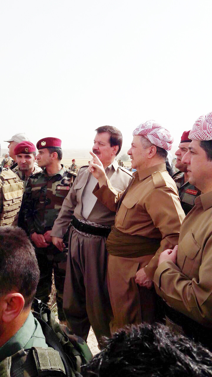 KDP President Masoud Barzani (second from right) and Peshmerga Commander Kemal Kirkuki speak during the Kurdish leader's visit to troops near the town of Perde (Altun Kupri), north of Kirkuk, on June 16, 2018. 