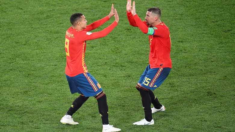 Spain's forward Rodrigo (left) and Spain's defender Sergio Ramos celebrate their second goal during the 2018 World Cup Group B football match between Spain and Morocco at the Kaliningrad Stadium in Kaliningrad, Russia, on June 25, 2018. (Photo: AFP/Ozan Kose)