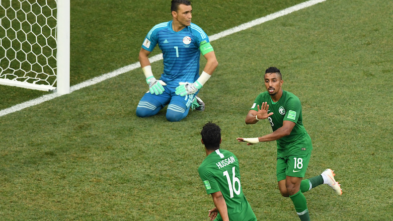 Saudi Arabia's forward Salem Al-Dawsari (right) celebrates after scoring the winning goal during the 2018 World Cup Group A football match between Saudi Arabia and Egypt at the Volgograd Arena in Volgograd, Russia, on June 25, 2018. (Photo: AFP/Mark Ralston)