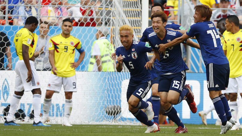 Japan's forward Yuya Osako (second from right) celebrates with teammates after scoring a goal during the 2018 World Cup Group H football match between Colombia and Japan at the Mordovia Arena in Saransk, Russia on June 19, 2018. (Photo: AFP/Jack Geuz)