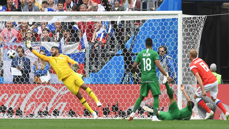 Russia's midfielder Yuri Gazinskiy (right) scores the opener during the 2018 World Cup Group A football match between Russia and Saudi Arabia at the Luzhniki Stadium in Moscow on June 14, 2018. (Photo: AFP/Francisco Leong)