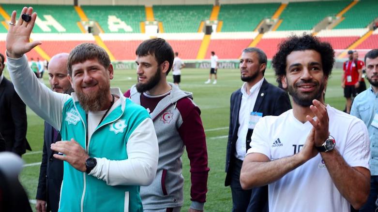Leader of the Chechen Republic Ramzan Kadyrov (left) and Egypt's Mohamed Salah wave at fans at a stadium in Chechen where the national team were based for the 2018 FIFA World Cup. (Photo: Associated Press)
