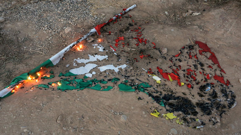 A Kurdistan flag smoulders in the province of Kirkuk after Iraqi forces and the Shia militias tookover the area, Oct. 16, 2017. (Photo: Reuters)