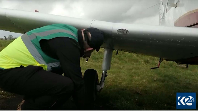 Saman Baban inspects his plane before takeoff. 