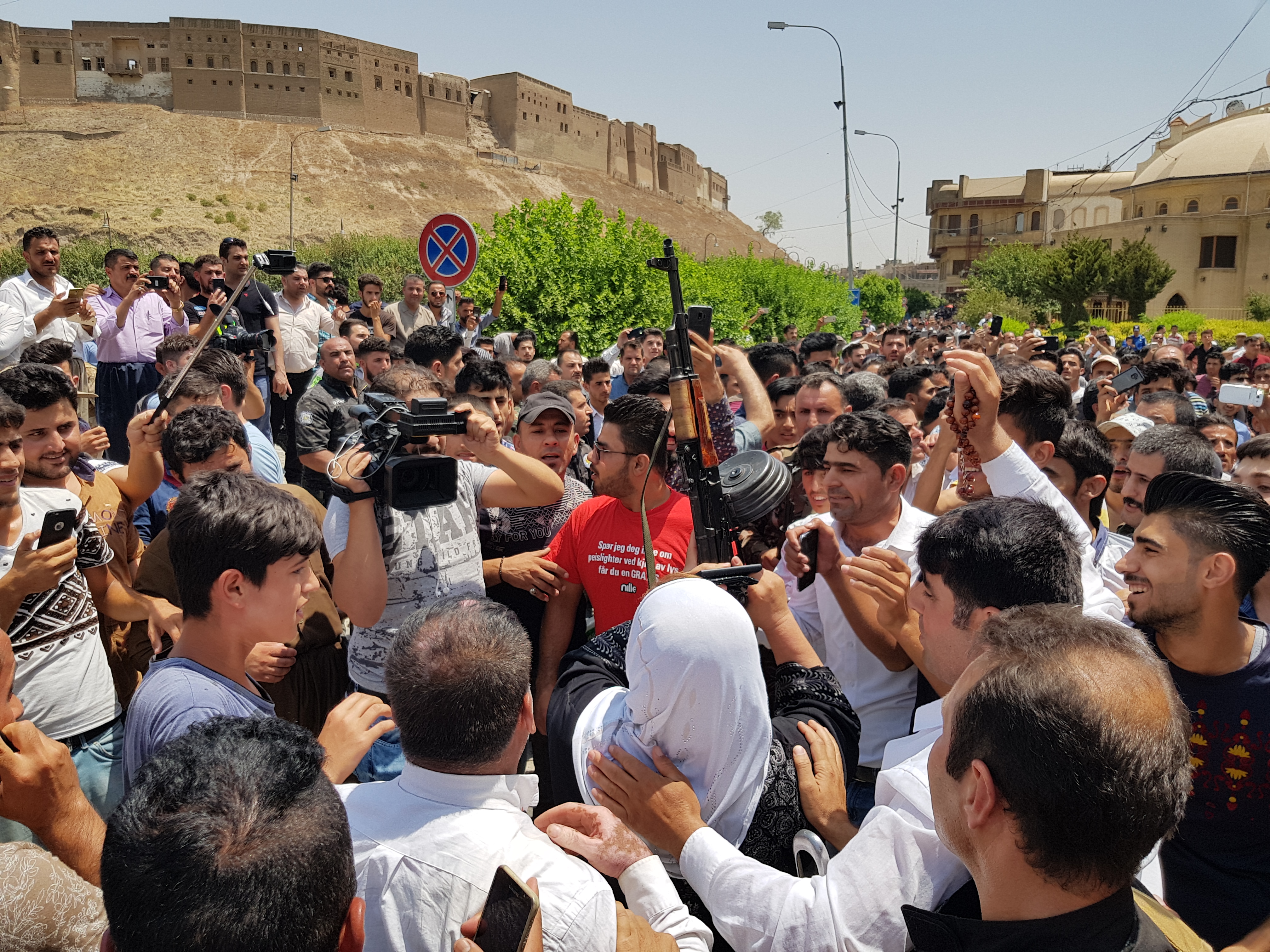 People gather outside of the Erbil Governorate building where an attack took place early in the morning, July 23, 2018. (Photo: Kurdistan 24/Wladimir van Wilgenburg)