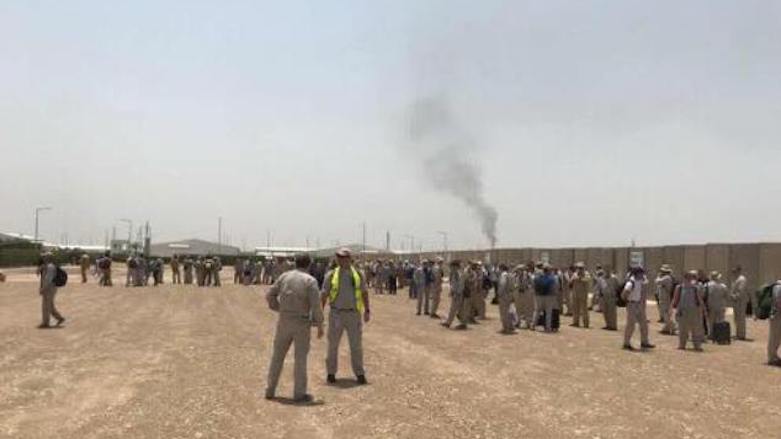 The staff of oil company Russian Lukoil prepares to evacuate one of the oilfields besieged by protesters in Basra. (Photo: Social media) 