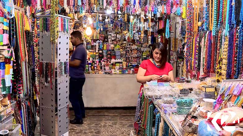 A woman shops among various embroidery supplies, July 22, 2018. (Photo: Kurdistan 24)