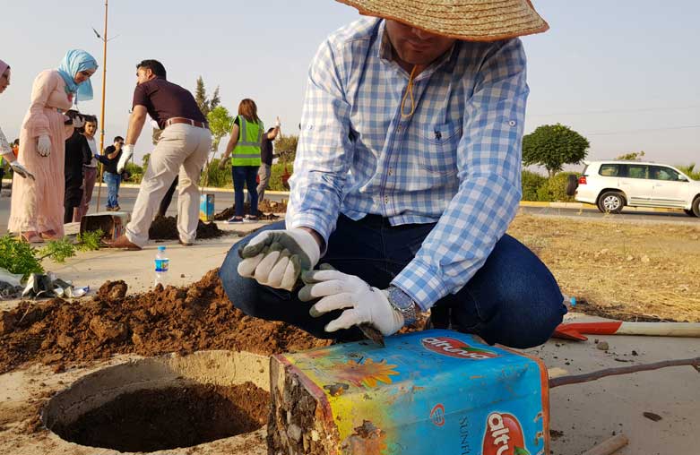 Volunteers planted trees in Halabja, Aug. 3, 2018. (Photo: Kurdistan 24/Wladimir van Wilgenburg)