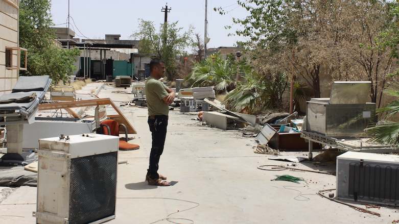 Nori Sharif takes in the destruction of the Jalawla Medical Center a few years after the Islamic State overran it. (Photo: Nori Sharif)
