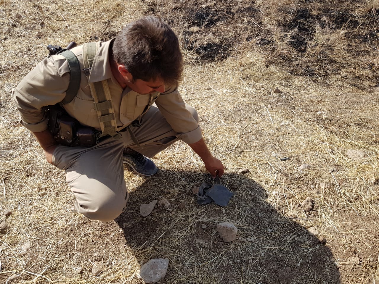 A Peshmerga fighter examines the scene of an Iranian missile attack on the headquarters of an Iranian Kurdish party in Koya, 100 kilometers east of the Kurdistan Region capital of Erbil, Sept. 8, 2018. (Photo: Wladimir Van Wilgenburg)