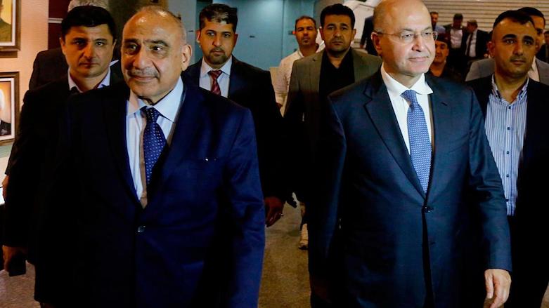 Iraq's new President Barham Salih (right) with new Prime Minister Adel Abdul Mahdi (left) in the parliament building in Baghdad. (Photo: Associated Press/Karim Kadim)