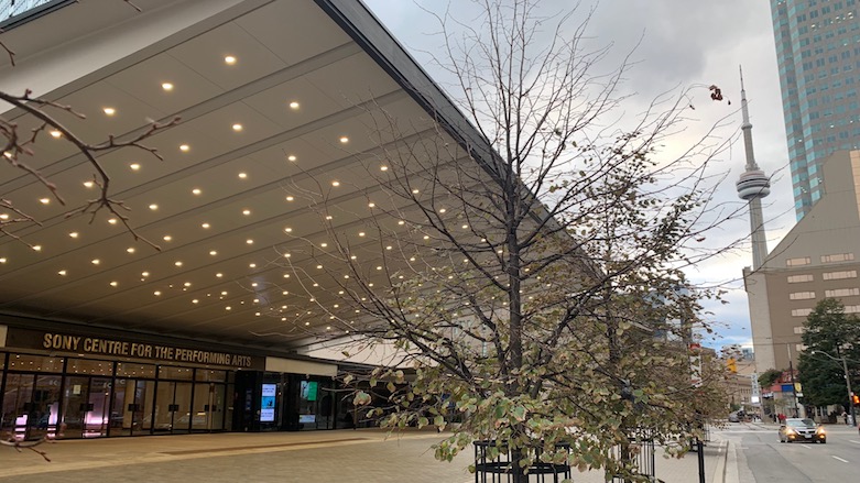 The iconic CN Tower is seen in the distance from the front of the Sony Centre for the Performing Arts in Toronto, Canada. (Photo: Kurdistan 24)