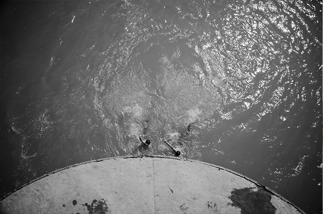 Boys diving and swimming at the bridge. (Photo: Levi Clancy)