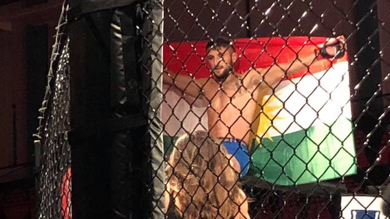 Serdar Altas draped himself in the Kurdistan flag after his knockout victory on the main card of Fight Club Rush 3 at the Bombardier Arena in Västerås, Sweden, Aug. 18, 2018. (Photo: MMAnytt/Ashah Tafari)