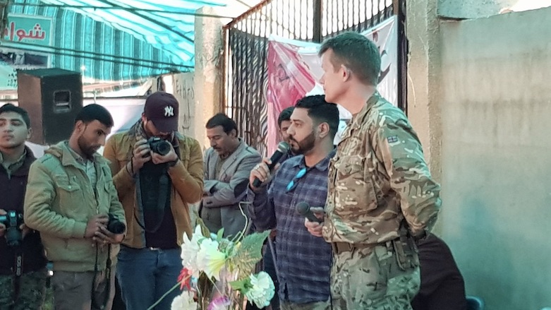 British Brigadier General Nicholas Pond (right) praised Omar Alloush, who was assassinated one year ago in his home in Tal Abyad. (Photo: Kurdistan 24/Wladimir van Wilgenburg)