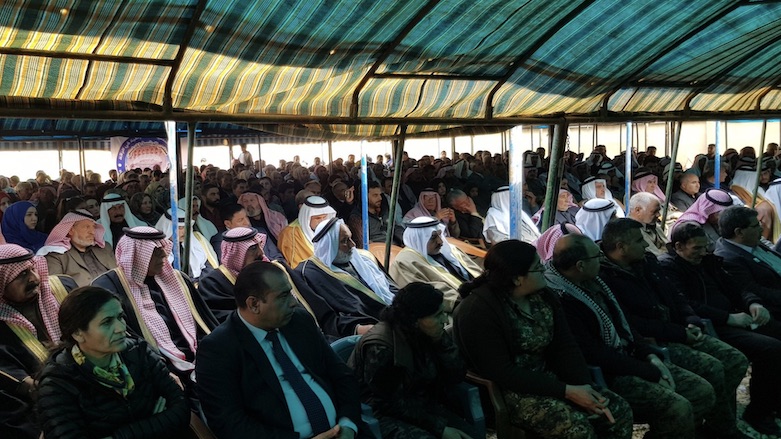 Senior tribal leaders, local politicians and military officials, and a delegation from the US-led Coalition attend a ceremony in the town of Ain Issa, Syria, for local Kurdish official Omar Alloush who was killed one year ago, March 15, 2019. (Photo: Kurdistan 24/Wladimir van Wilgenburg)