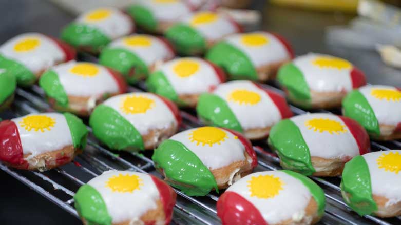Donuts decorated with the Kurdish flag. (Photo: Levi Clancy/Kurdistan 24)