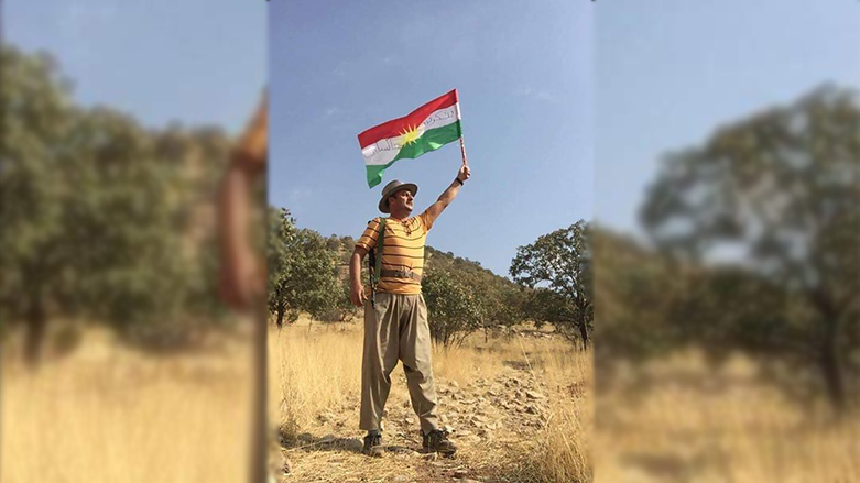 Hakim Goran holding a flag of the Kurdistan Region in an undated photo. (Photo: social media)