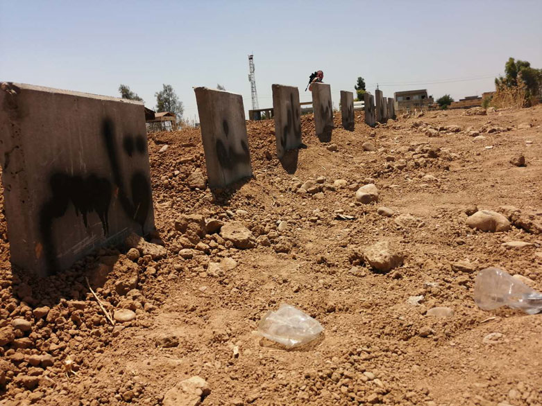 Graves of the family members at a cemetery in Daquq, July 25, 2019. (Photo: Kurdistan 24)