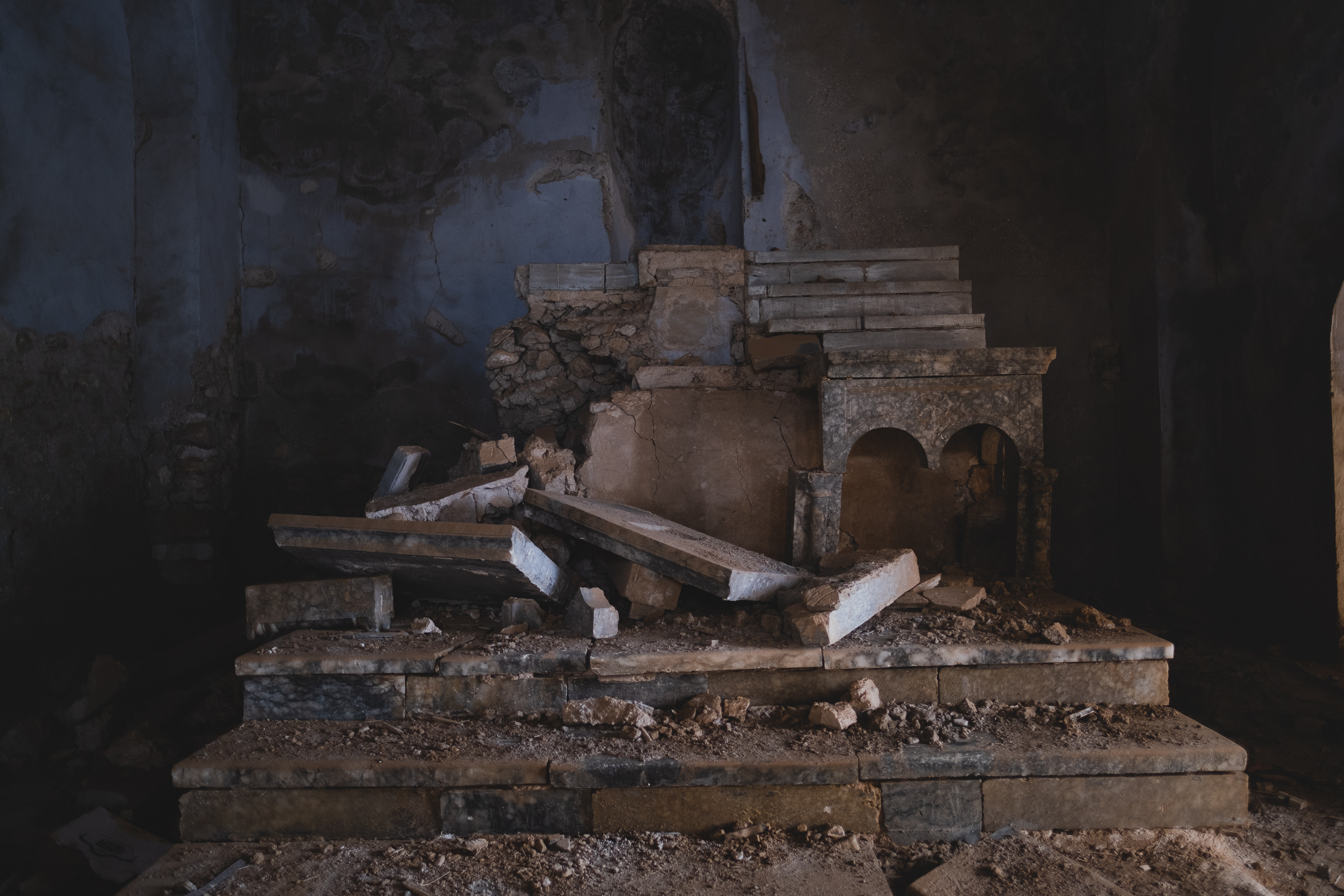 The altar at the Syriac Catholic Cathedral of the Heart of Jesus was destroyed, and marks on adjacent walls suggest this was done by a detonation. (Photo: Kurdistan 24/Levi Clancy)