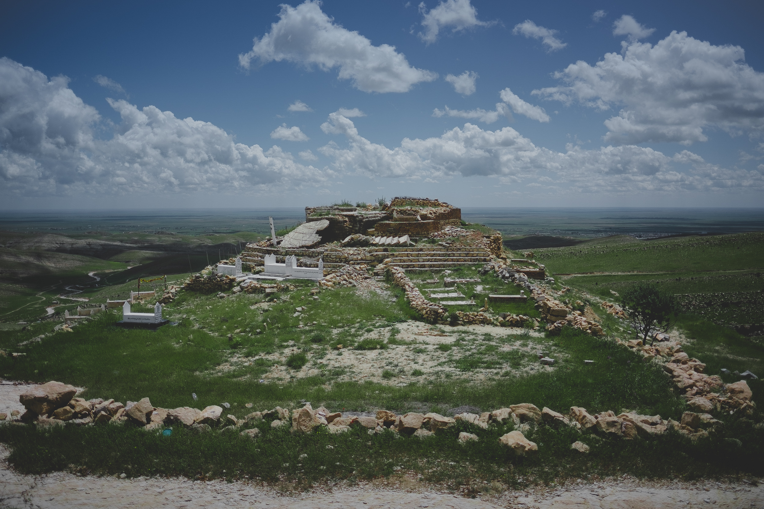 The Ezidi Shrine of Mahma Reshan is perched in the hills of Shingal mountain and overlooks the town. (Photo: Kurdistan 24/Levi Clancy)