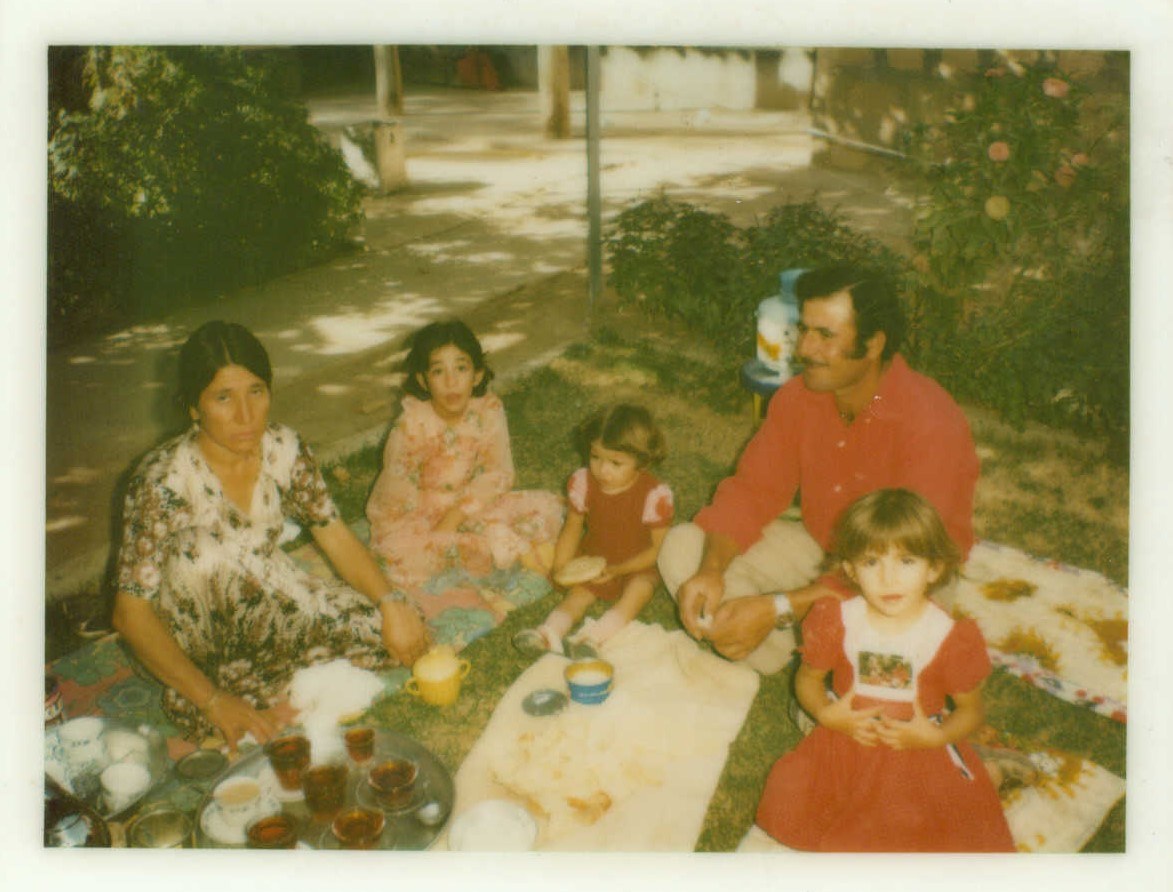 Florin (middle), her parents, and her two older sisters in Diyana.