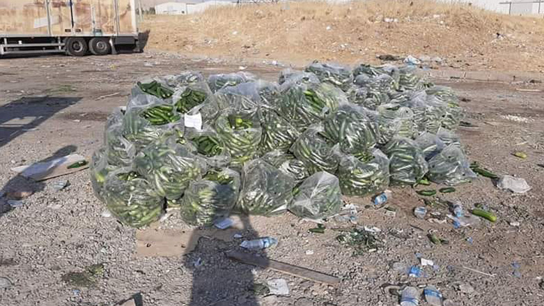 A local Kurdish farmer dumped tons of cucumber for thier low market prices. (Photo: Social Media)