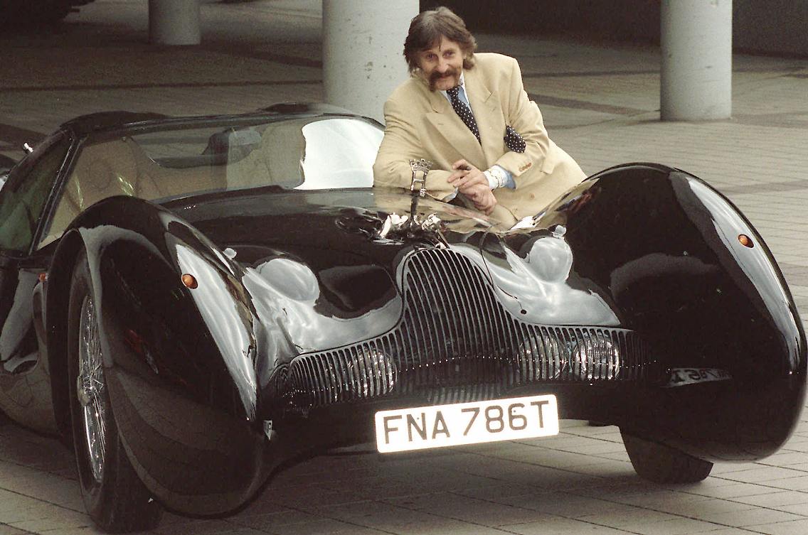 The late Luigi Colani poses next to one of his concept car designs. (Photo: Associated Press)