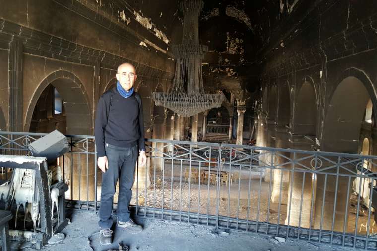 Georges Jahola at the Al-Tahira church in Bakhdida in November 2016, shortly after the town's liberation. (Photo: CNA/Georges Jahola)