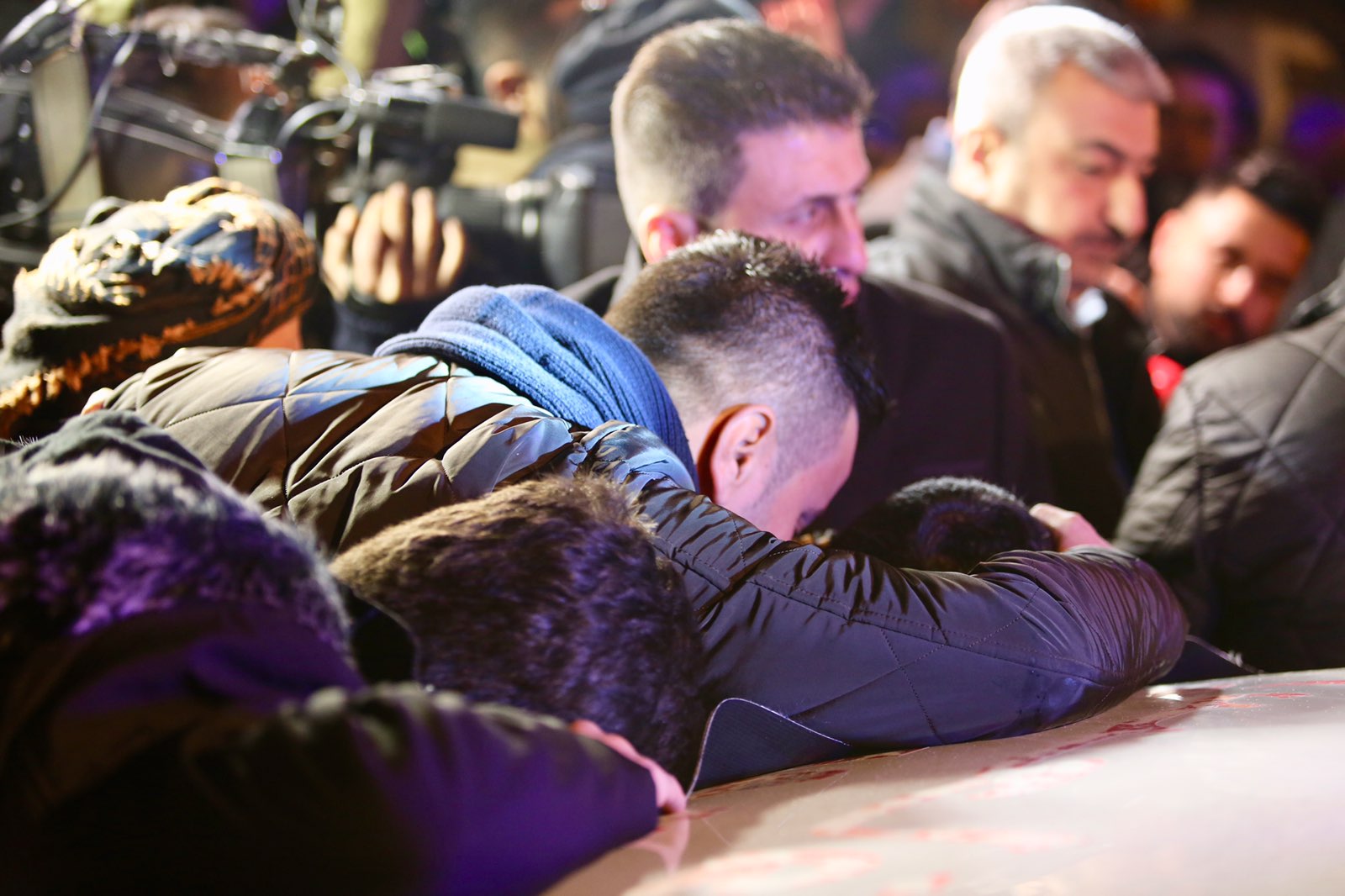 Grieving families in the Kurdistan Region's city of Sulaimani receive the bodies of five persons who recently died after a boat carrying them sank in the territorial waters between Greece and Italy, Jan. 25, 2020. (Photo: Kurdistan 24)