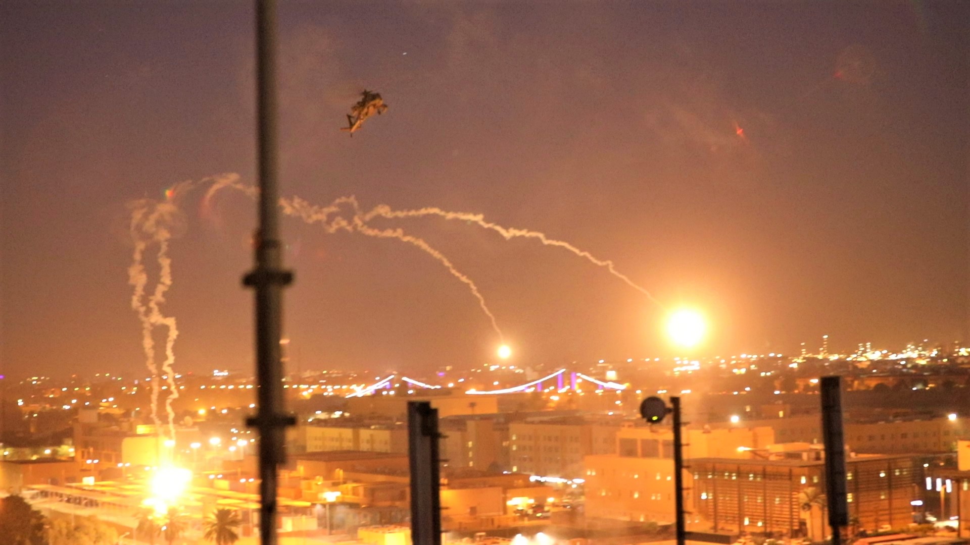 A US army apache helicopter drops flares over Baghdad's high-security Green Zone on Dec. 31, 2019, after Iraqi supporters of pro-Iran factions breached the outer wall of the US embassy over weekend airstrikes that killed pro-Iran fighters in western Iraq. (Photo: US Embassy in Iraq/AFP)