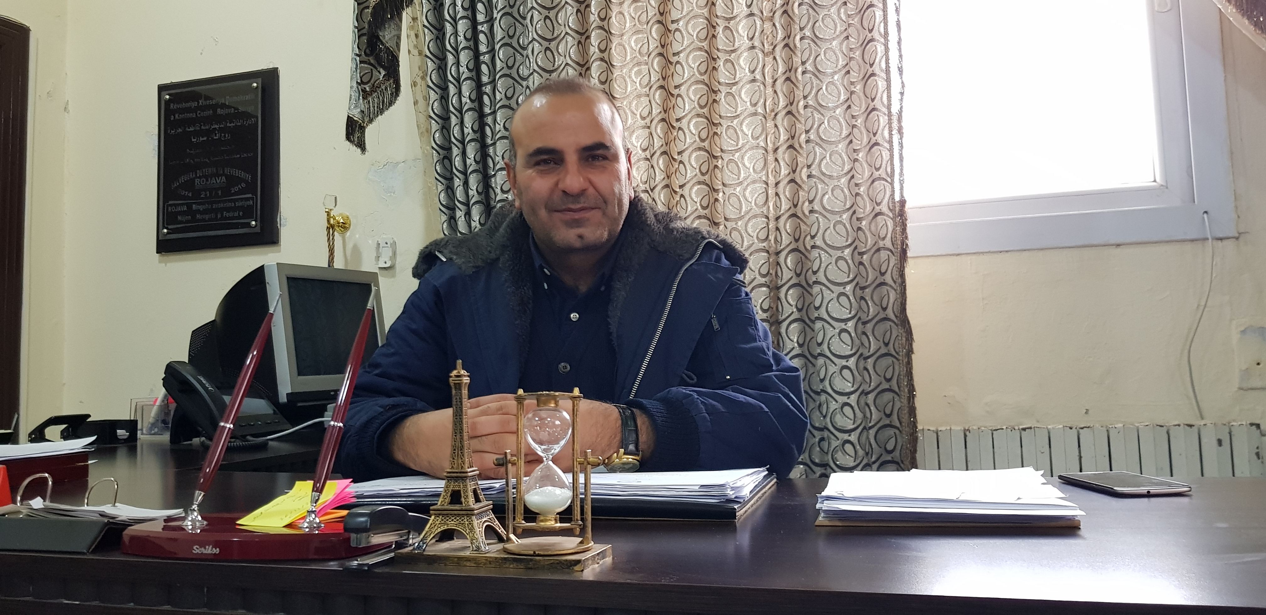 Co-Chair of the Executive Council of the Democratic Autonomous Administration (DAA) of the Euphrates Region, Anwar Muslim, smiles during an interview with Kurdistan 24 in Kobani, Dec. 10, 2019. (Photo: Kurdistan 24/Wladimir van Wilgenburg)