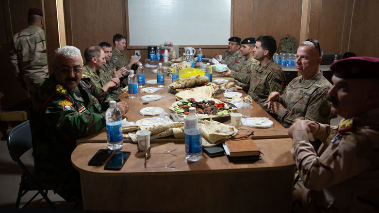 Coalition forces gather to have lunch provided by Brig. Gen. Ali Abdalwahid Jassim at al-Qaim Base, Iraq, March 17, 2020. (Photo: CJTF-OIR)