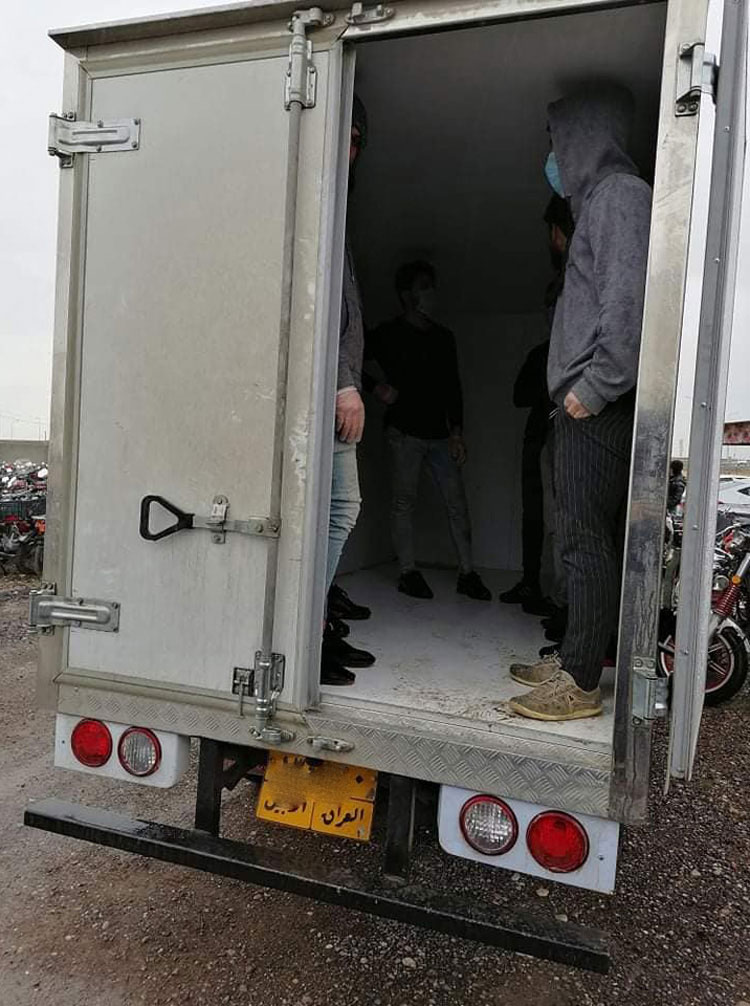 One of the five vehicles whose drivers attempted to smuggle 52 individuals into Erbil in violation of the coronavirus curfew, March 28, 2020. (Photo: Erbil Traffic Police)