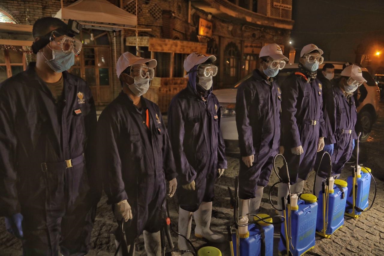 City workers spray disinfectant at an Erbil market, March. 7, 2020. (Photo: Kurdistan 24/Iman Farman)