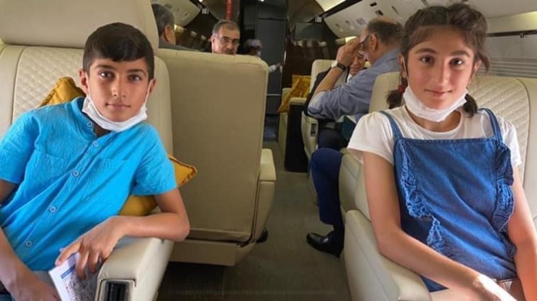 The two Yezidi children aboard a flight back to the Kurdistan Region with an official Kurdish delegation led by President Nechirvan Barzani. (Photo: Kurdistan Region Presidency)