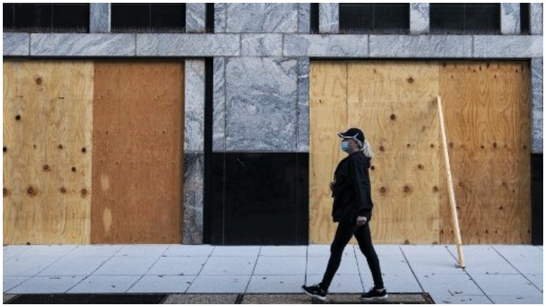 Wooden boards protect a Starbucks location near the White House in Washington, DC in the runup to the Nov. 3, 2020 presidential election. (Alex Edelman AFP)